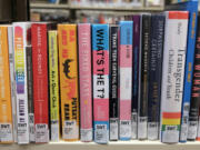 A selection of books that deal with LGBTQ+ issues is seen here at the Southwest Branch of the Seattle Public Library. Calls to ban books at public libraries have been increasing nationwide, including in Washington where the number of titles challenged state has skyrocketed from 10 in 2017 to 42 in 2021, according to the ALA.