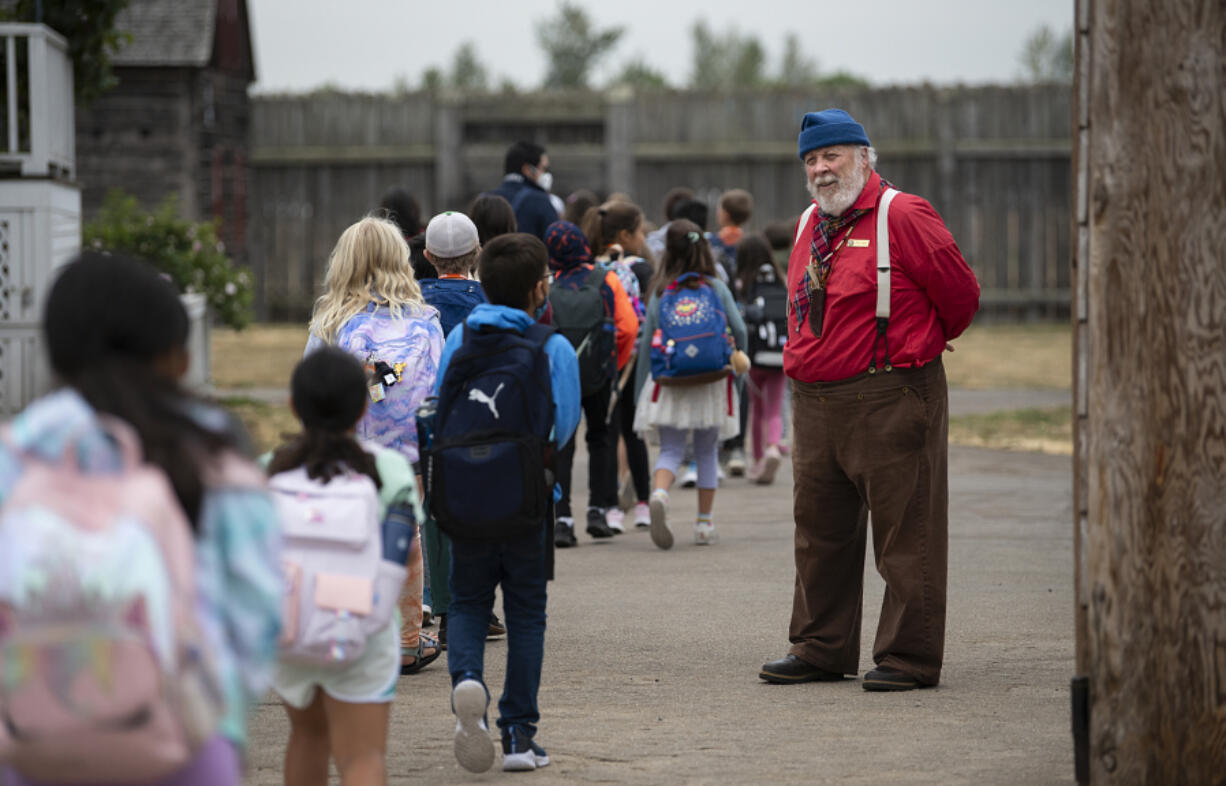 Volunteer Mike Riley welcomes students from Vancouver Innovation, Technology and Arts Elementary School to Fort Vancouver National Historic Site on Sept. 13, 2022.