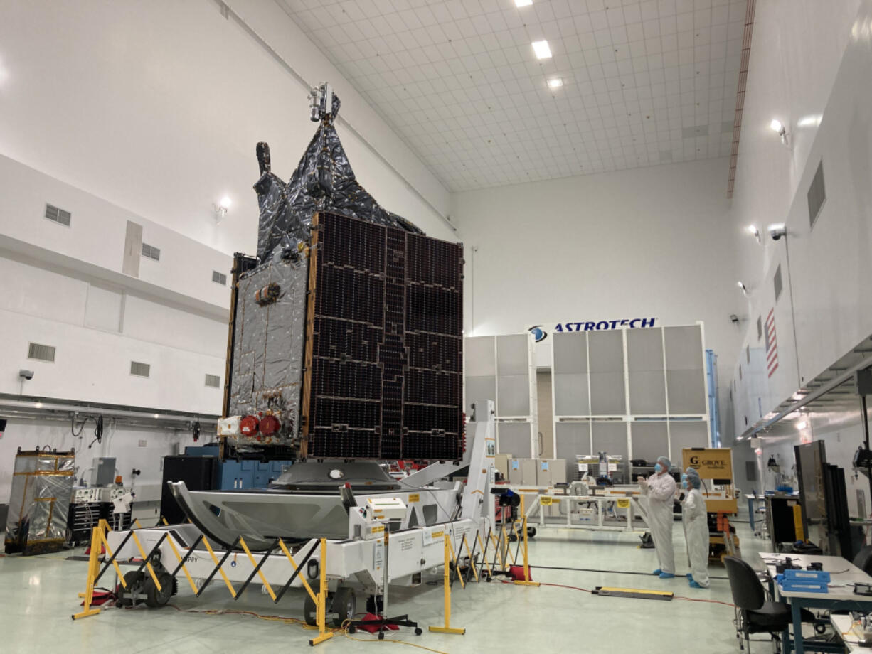 NASA's Psyche project manager Henry Stone shows journalists the probe in the clean room at Astrotech's facilities in Titsusville, Florida on Friday, Aug. 11, 2023.