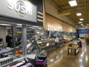 The recently remodeled sushi, deli and bakery sections are seen July 26 at a Kroger Marketplace in Frisco, Texas.