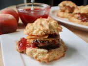 Start the day off right with a homemade sausage biscuit topped with refrigerator raspberry-peach jam.