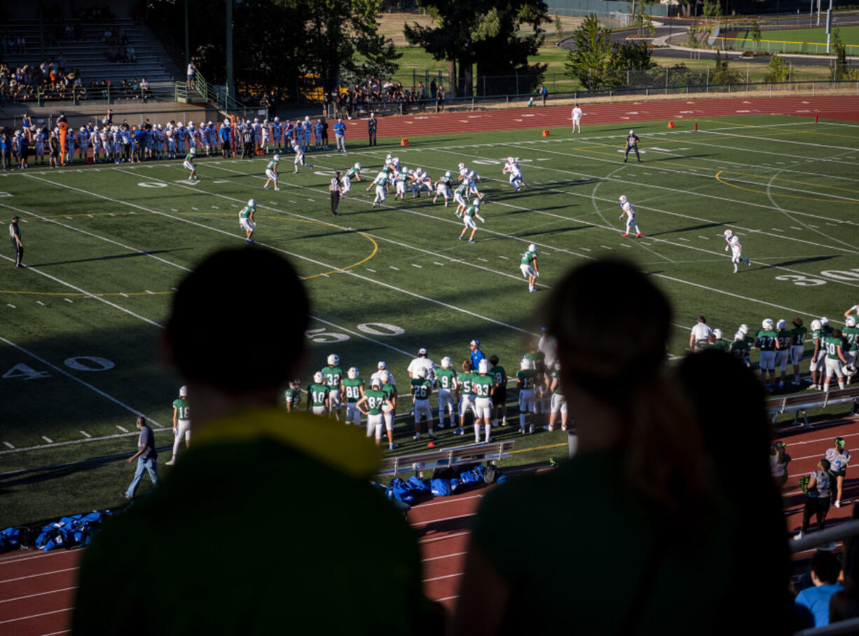 Fans watch a play from the stands Friday, Sept. 9, 2022, during Mountain View?s 26-20 triple overtime win against Ridgefield at McKenzie Stadium.