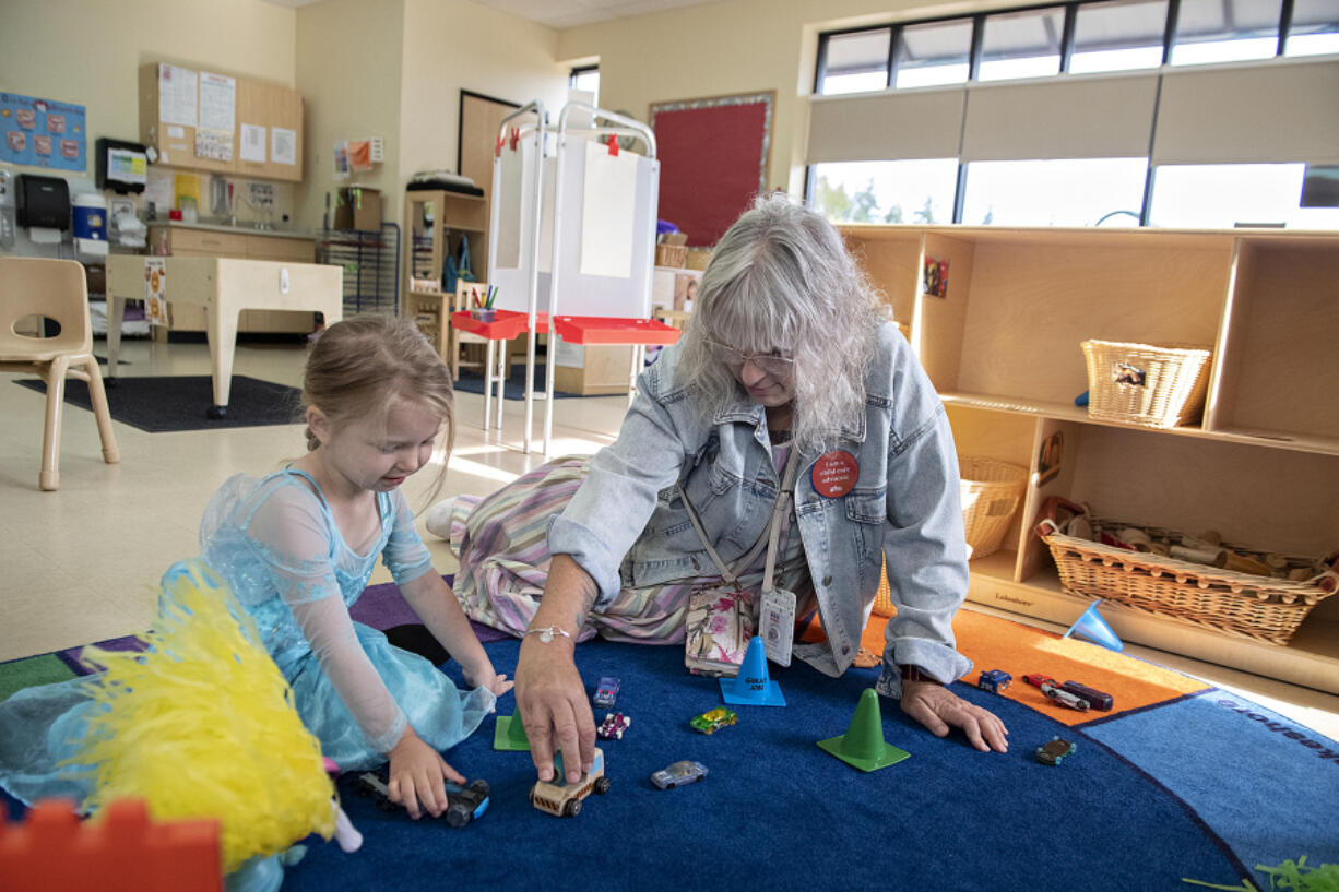 Preschooler Kymber McIntyre, 4, left, enjoys some playtime with Kim Frosh, Child Care Aware Specialist with Educational Service District 112, as she takes a tour of the Educational Opportunities for Children and Families' location in northeast Vancouver in August 2023.