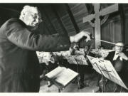 Walter Cleland conducts the Vancouver Symphony Orchestra in December 1986. The Nebraska farm boy with perfect pitch spent his life teaching, conducting and writing music and could play any instrument he picked up. He started several music groups in Vancouver before launching the Vancouver Symphony. He retired in 1990.