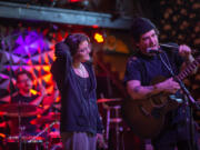 Erin Blake, 15, at left, and her uncle Avery Camacho of Vancouver play an original song during a recent open mic night at Brickhouse.