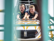 Kids ride the Zillerator Coaster ride on Friday, Aug. 4, 2023, at the Clark County Fair.