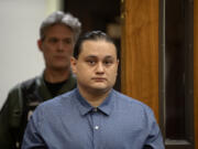 Defendant Abran Raya Leon enters the courtroom Tuesday for his felony murder trial in Clark County Superior Court. He is accused of participating in a firearms trafficking scheme with his wife, Misty Raya, and brother, Guillermo Raya Leon, who allegedly fatally shot Clark County sheriff's Sgt. Jeremy Brown.