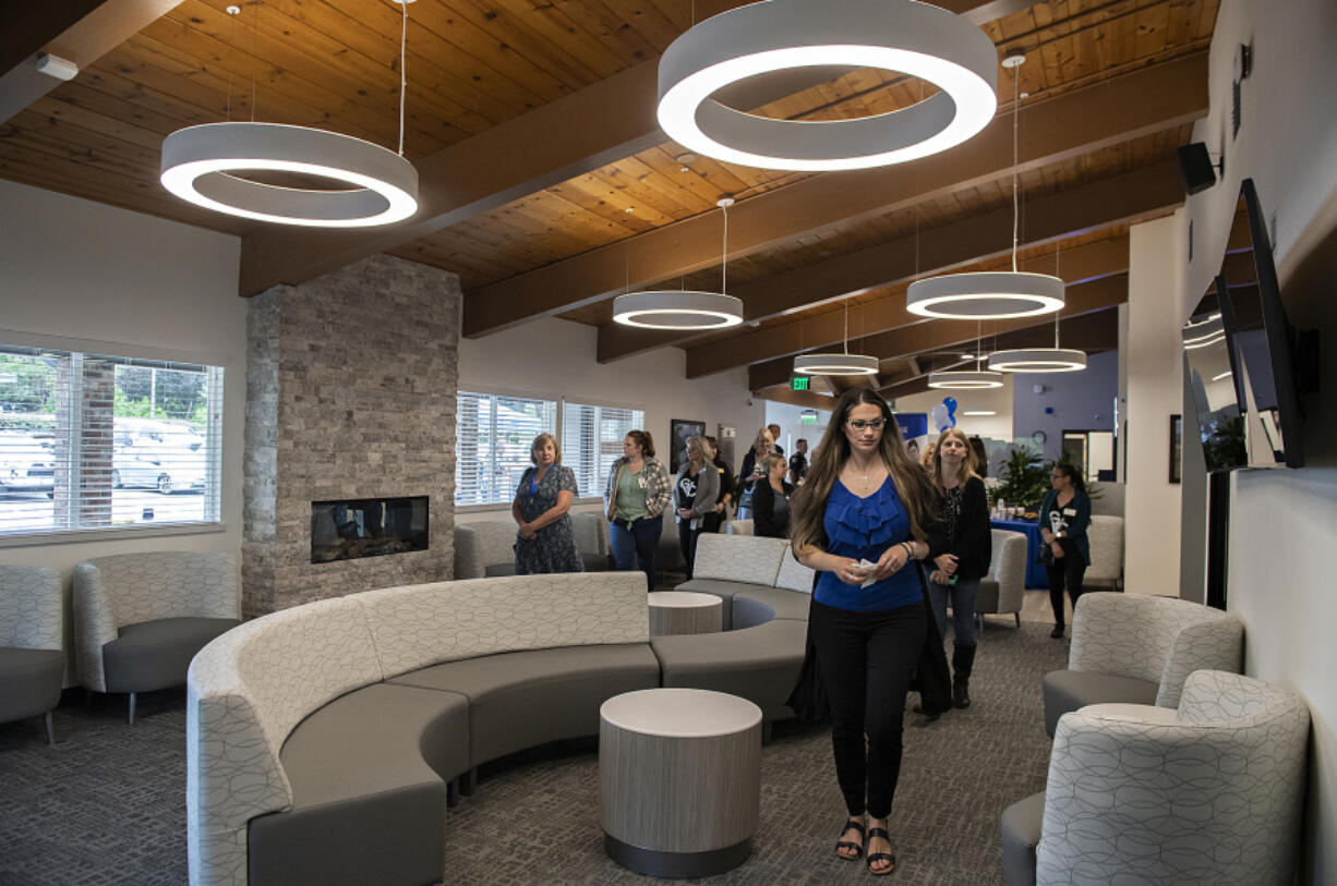 Kelly Ferguson, foreground right, chief operating officer of Columbia River Mental Health Services, leads a tour through the waiting room at the new NorthStar Clinic. Columbia River Mental Health Services offers the largest opioid treatment program in Southwest Washington at the new facility. It will treat all people in any stage of recovery.