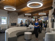 Kelly Ferguson, foreground right, chief operating officer of Columbia River Mental Health Services, leads a tour through the waiting room at the new NorthStar Clinic. Columbia River Mental Health Services offers the largest opioid treatment program in Southwest Washington at the new facility. It will treat all people in any stage of recovery.