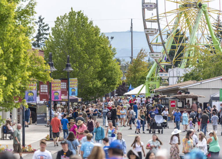 People walk around the Clark County Fairgrounds on Aug. 4 at the Clark County Fair.