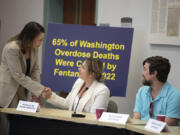 U.S. Sen. Maria Cantwell, from left, greets Kaylee Collins of Lifeline Connections while joined by Niles Haas of the Xchange program before the start of the fentanyl roundtable.