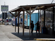 Customers take a minute to decide their lunch order while visiting the food carts at Living Hope Church on Northeast Andresen Road.