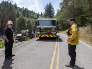 Battalion Chief Jason Leavitt, left, and Division Chief Ben Peeler take a moment to check in at the Jenny Creek Fire near La Center on Thursday afternoon, Aug. 17, 2023.