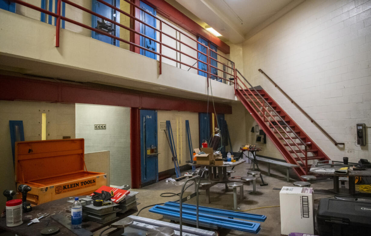 Construction equipment sits in a cell block while crews work on upgrading doors and plumbing at the Clark County Jail.