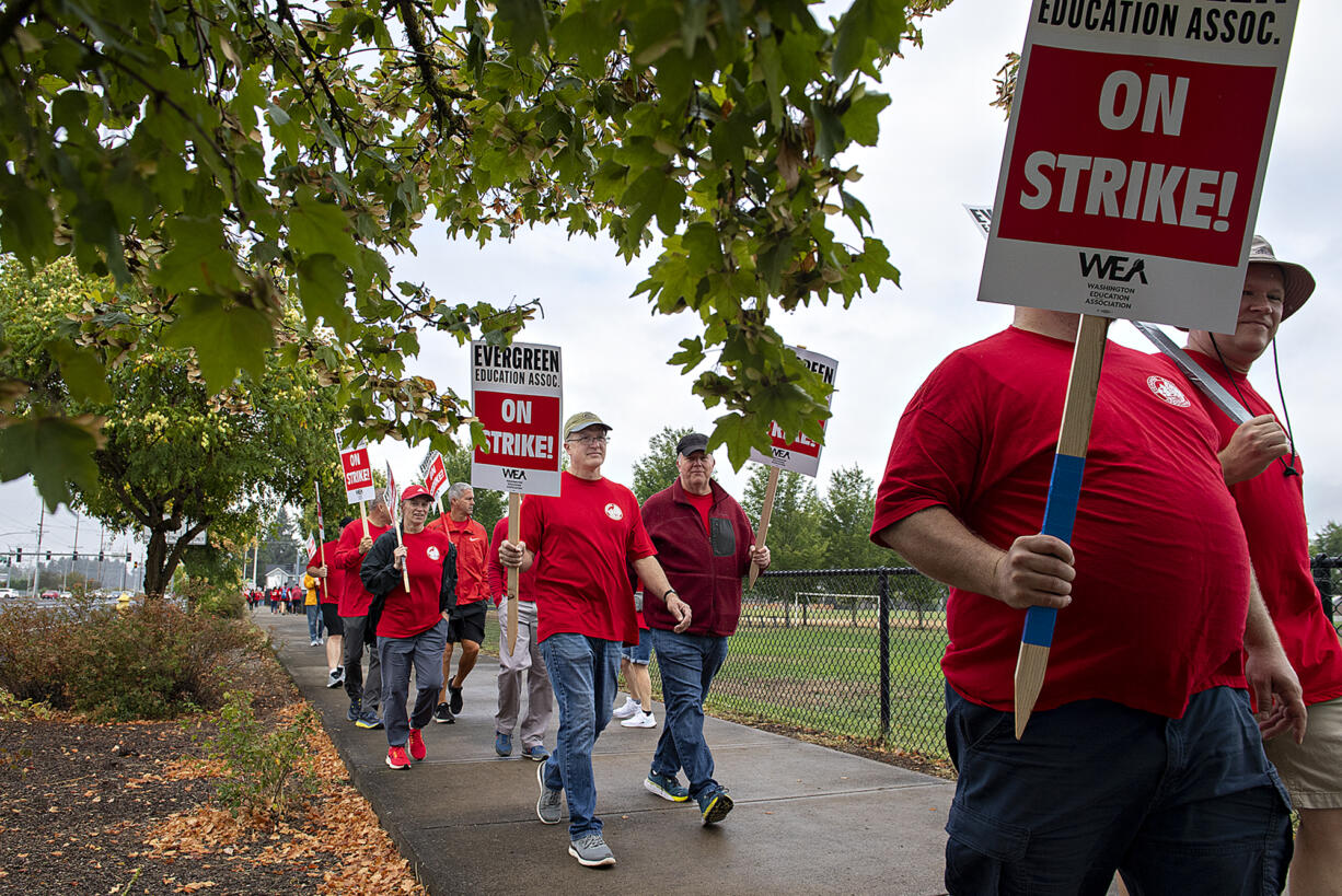 Members of the Evergreen Education Association picket outside Evergreen High School on Wednesday morning, Aug. 30, 2023.