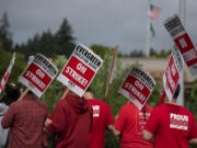 Members of the Evergreen Education Association gather on the picket line outside Evergreen High School on Wednesday morning, Aug. 30, 2023.