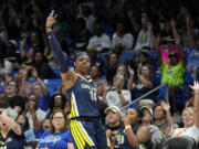 Dallas Wings guard Arike Ogunbowale celebrates after sinking a 3-point basket during the first half of the team's WNBA basketball game against the Washington Mystics, Friday, July 28, 2023, in Arlington, Texas.