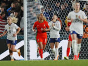 United States' Alex Morgan, center, reacts after missing a shot during the second half of the FIFA Women's World Cup Group E soccer match between Portugal and the United States at Eden Park in Auckland, New Zealand, Tuesday, Aug. 1, 2023.