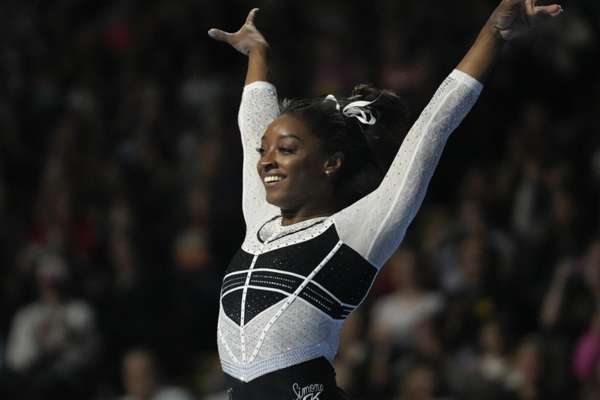 Simone Biles reacts after performing in the floor exercise at the U.S. Classic gymnastics competition Saturday, Aug. 5, 2023, in Hoffman Estates, Ill.