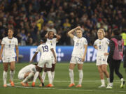 United States' players react after losing their Women's World Cup round of 16 soccer match against Sweden in a penalty shootout in Melbourne, Australia, Sunday, Aug. 6, 2023.