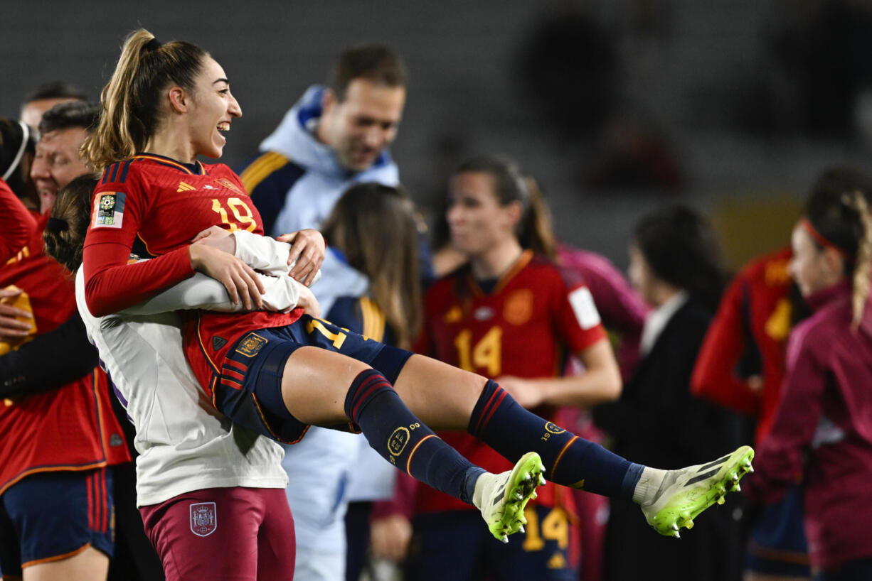 Spain's Olga Carmona is held aloft by a teammate after defeating Sweden in the Women's World Cup semifinal soccer match at Eden Park in Auckland, New Zealand, Tuesday, Aug. 15, 2023.