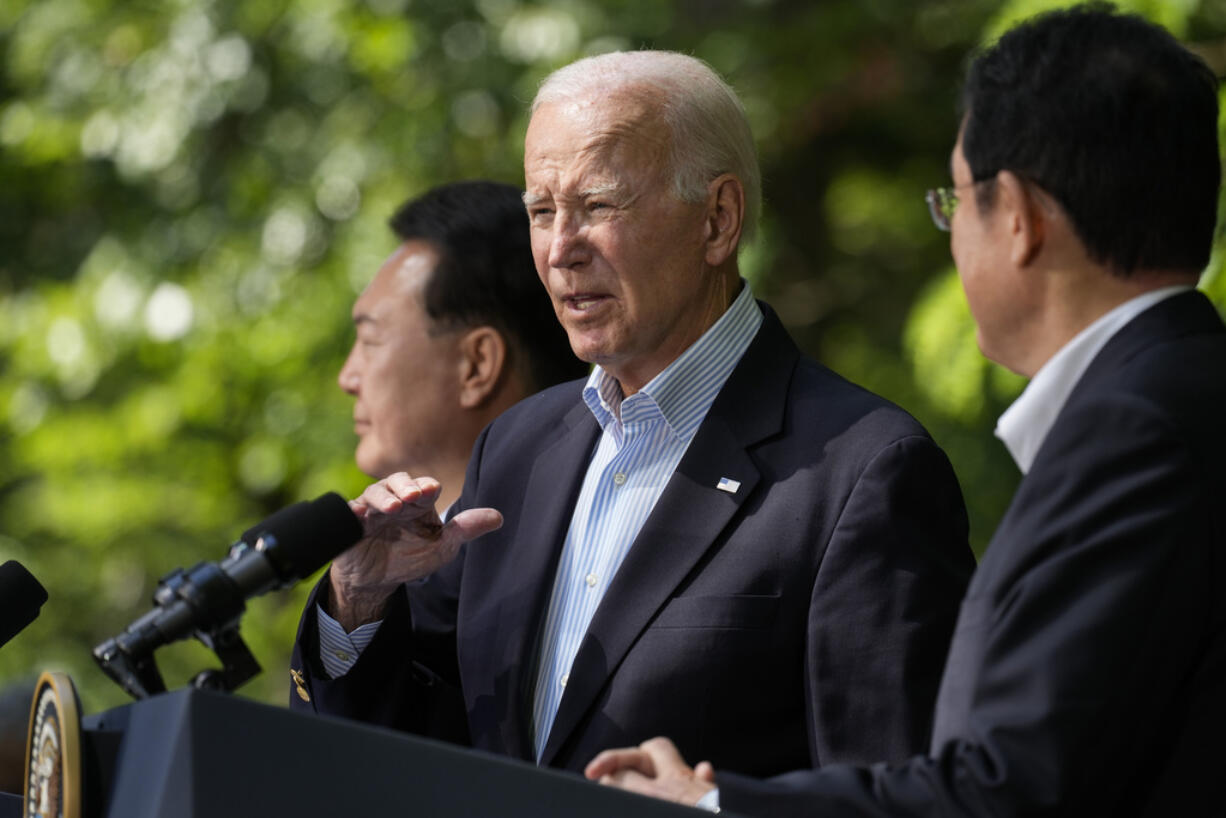 President Joe Biden, center, stands with South Korean President Yoon Suk Yeol, left, and Japanese Prime Minister Fumio Kishida, during a joint news conference Friday, Aug. 18, 2023, at Camp David, the presidential retreat, near Thurmont, Md.