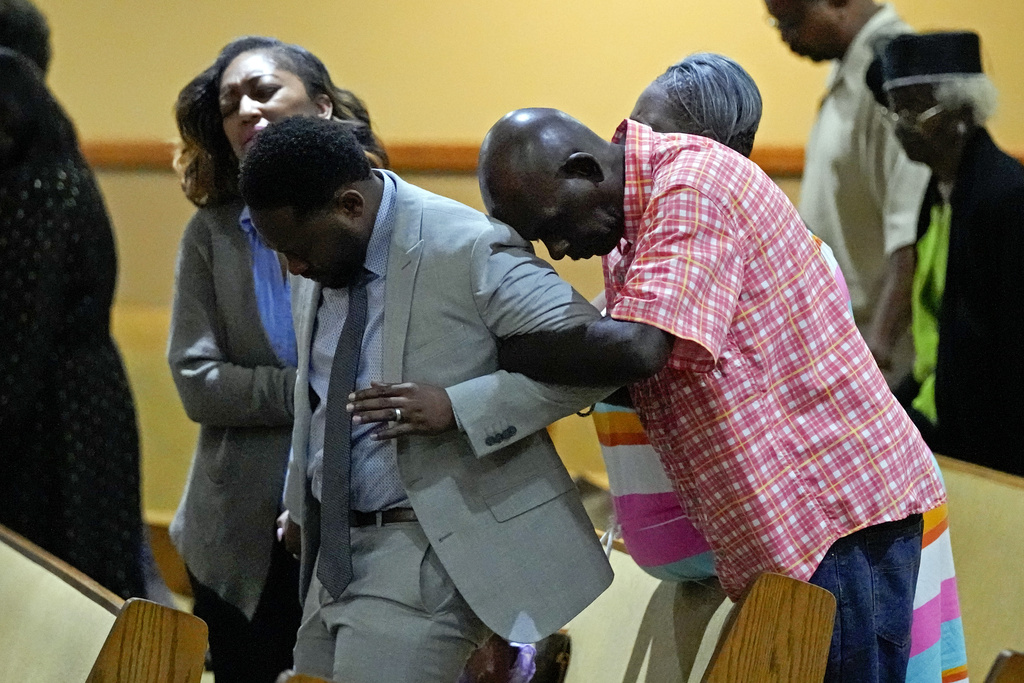 Parishioners pray during a service for the victims of a mass shooting at the St. Paul A.M.E. Church, Sunday, Aug. 27, 2023, in Jacksonville, Fla.