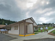 Incarcerated people at Larch Corrections Center line up outside the prison's mess hall to watch an Asian Pacific Islander event put on by fellow inmates in 2013.