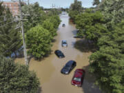 Cars are stranded in floodwaters on Sheldon Road south of Ford road in Canton, Mich., on Thursday. Officials say parts of southeast Michigan got more than 5 inches of rain by Thursday morning resulting in street flooding in the Detroit area.