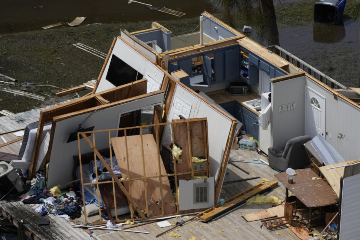 In this photo made in a flight provided by mediccorps.org, the remains of a destroyed home built atop a platform on piles are seen in Keaton Beach, Fla., following the passage of Hurricane Idalia, Wednesday, Aug. 30, 2023.