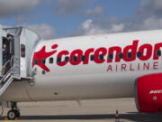 Cabin crew member Magdalini Michailidou stands on the gangway of the Corendon Airlines Europe plane at the airport Erfurt-Weimar in Erfurt, Germany, July 2, 2020.