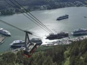 Cruise ships are shown near downtown Juneau on June 7, along the Gastineau Channel, in Alaska. A record number of cruise ship passengers are expected this year in the city of about 30,000 people.