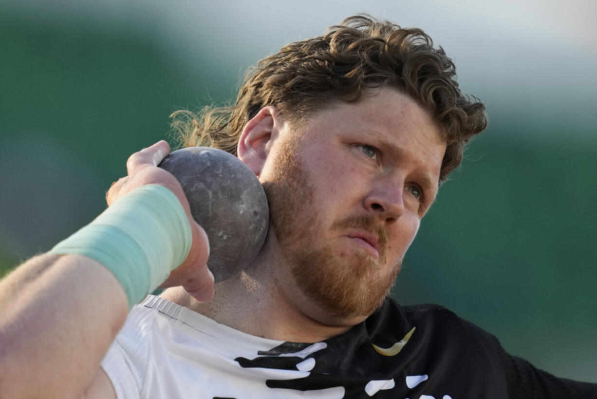 FILE - Ryan Crouser competes in the men's shot put during the U.S. track and field championships in Eugene, Ore., Sunday, July 9, 2023. To gain a little more distance, shot put world-record holder Ryan Crouser overhauled his mechanics in the offseason.