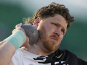 FILE - Ryan Crouser competes in the men's shot put during the U.S. track and field championships in Eugene, Ore., Sunday, July 9, 2023. To gain a little more distance, shot put world-record holder Ryan Crouser overhauled his mechanics in the offseason.