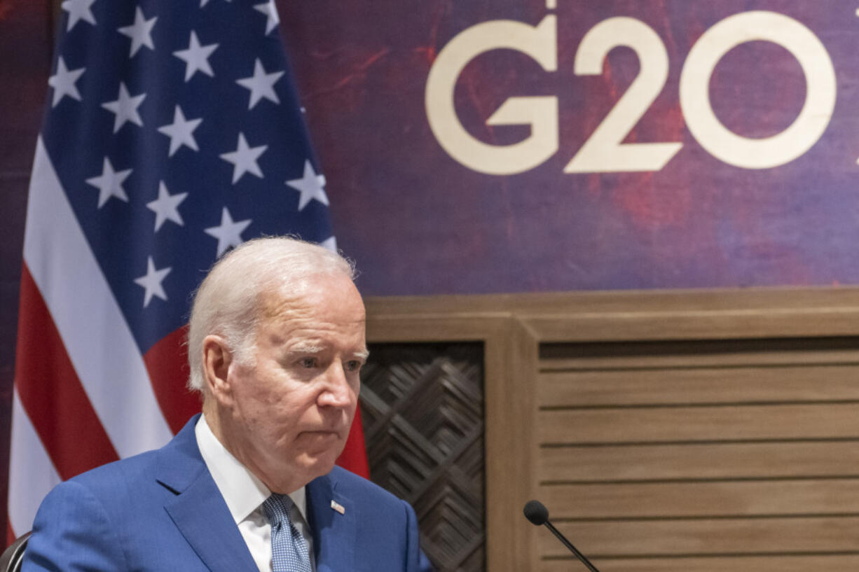 FILE - President Joe Biden pauses while speaking during a meeting with Indonesian President Joko Widodo on the sidelines of the G20 summit meeting, Monday, Nov. 14, 2022, in Bali, Indonesia. The White House announced Tuesday, Aug. 22, 2023, that President Joe Biden will attend next month's Group of 20 summit in New Delhi, India.