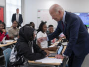 President Joe Biden greets students at Eliot-Hine Middle School in Washington, Monday, Aug. 28, 2023. Biden visited the school, located east of the U.S. Capitol, to mark the District of Columbia's first day of school for the 2023-24 year.