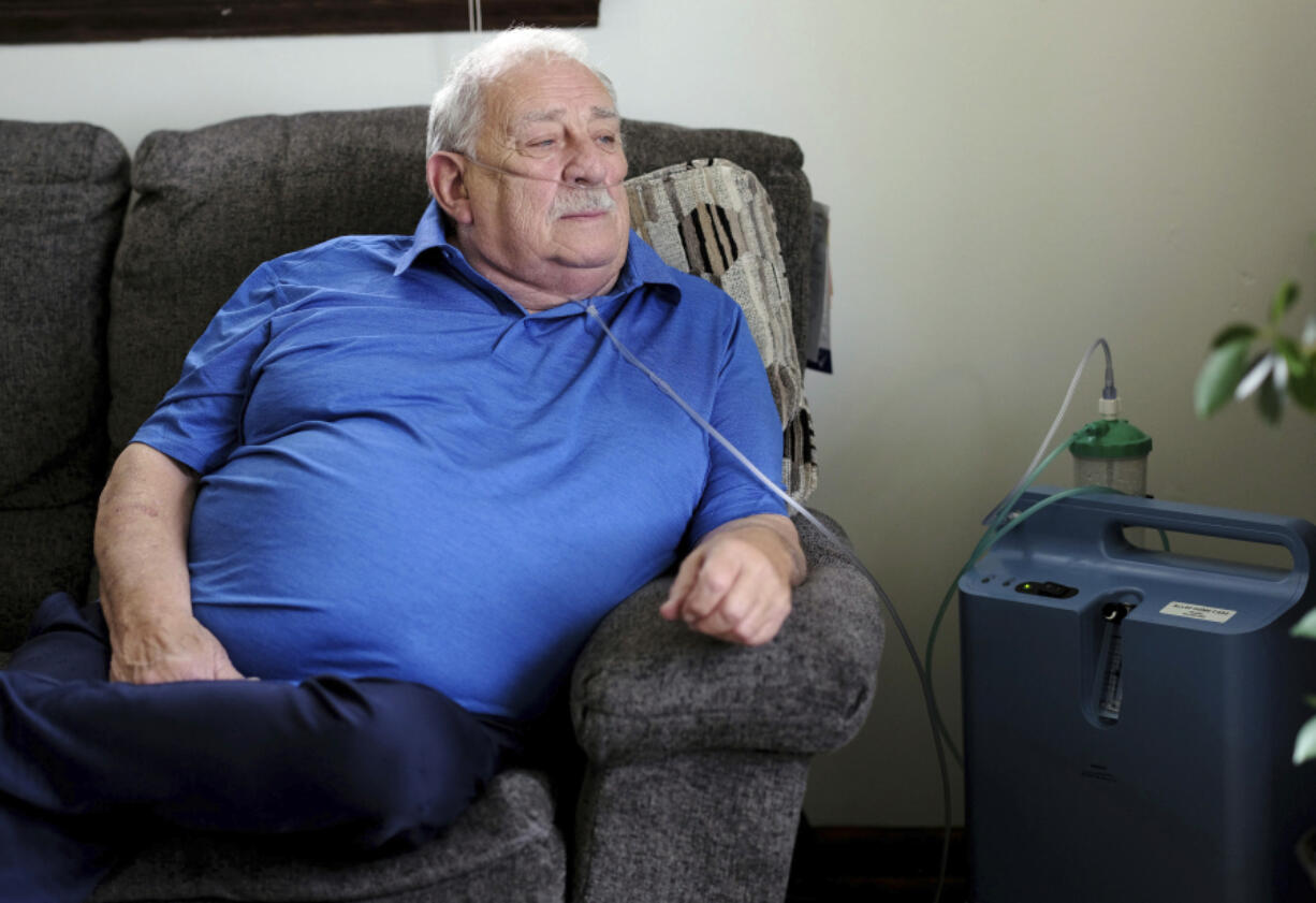 Retired coal miner James Bounds, who has pneumoconiosis, more commonly known as "black lung," poses for a photo at his home in Oak Hill, W.Va., Thursday, July, 13, 2023. Bounds said nothing can be done to reverse the debilitating illness he was diagnosed with at 37 in 1984. But he doesn't want others to suffer the same fate.