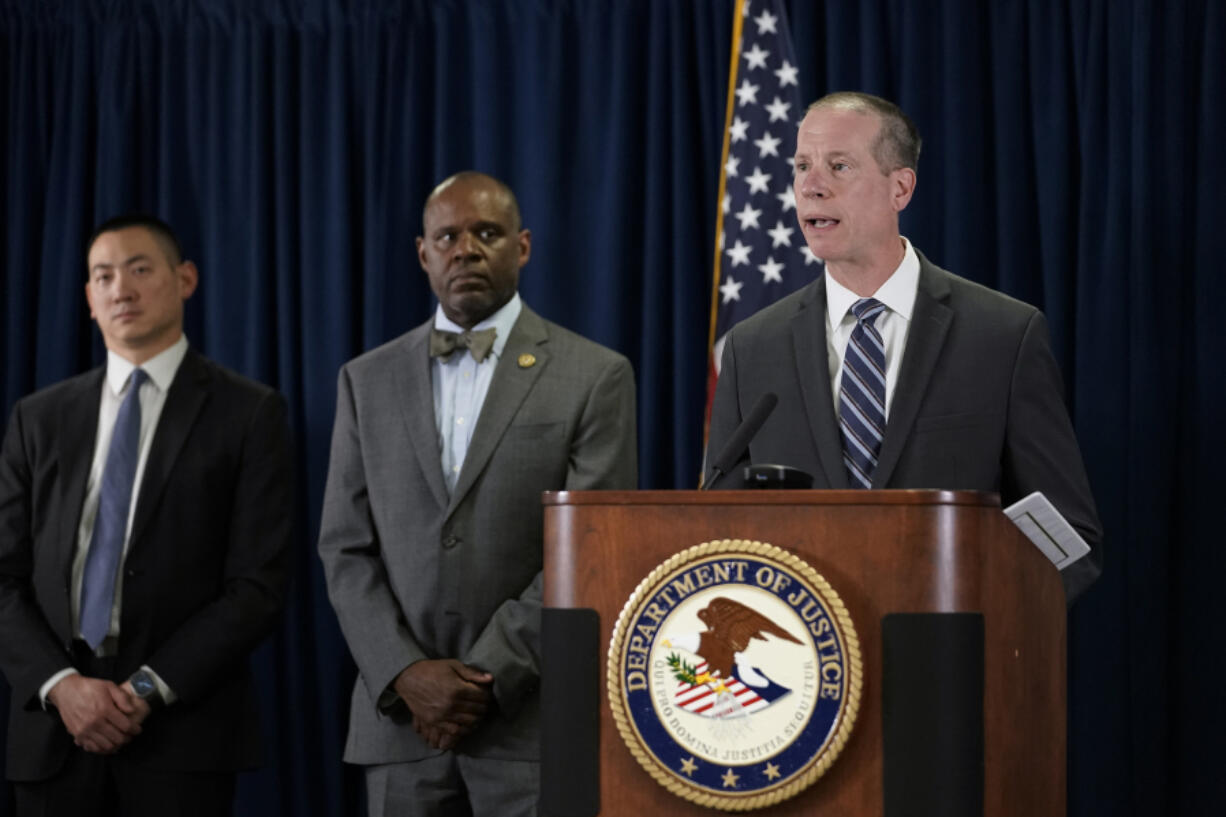 Robert Tripp, special agent in charge of the FBI's San Francisco Field Office, right, speaks to reporters during a press conference to announce federal authorities have charged 10 current and former Northern California police officers in a corruption investigation Thursday, Aug. 17, 2023, in San Francisco. Arrest warrants were served Thursday in California, Texas and Hawaii. (AP Photo/Godofredo A.