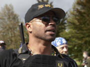 FILE - Proud Boys leader Enrique Tarrio speaks at a rally in Delta Park on Sept. 26, 2020, in Portland, Ore.