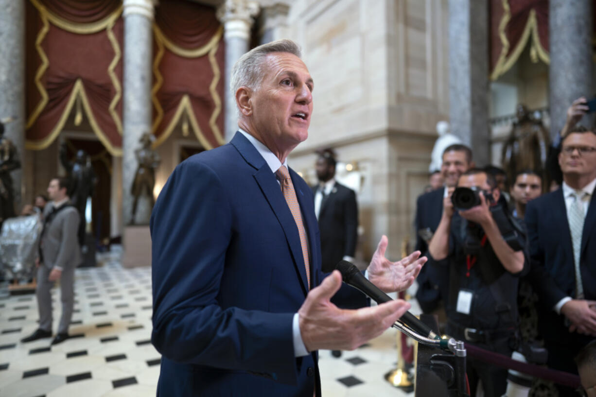 FILE - Speaker of the House Kevin McCarthy, R-Calif., talks to reporters at the Capitol in Washington, Monday, July 17, 2023. House conservatives in a group known as the Freedom Caucus have unveiled a list of demands that they want included in a stopgap spending measure to keep the federal government running after the end of September. It's a smorgasbord of non-starters for the Democratic-controlled Senate and the White House, signaling the challenges McCarthy will face next month to get a bill passed in the House without alienating a sizeable share of his conference. (AP Photo/J.