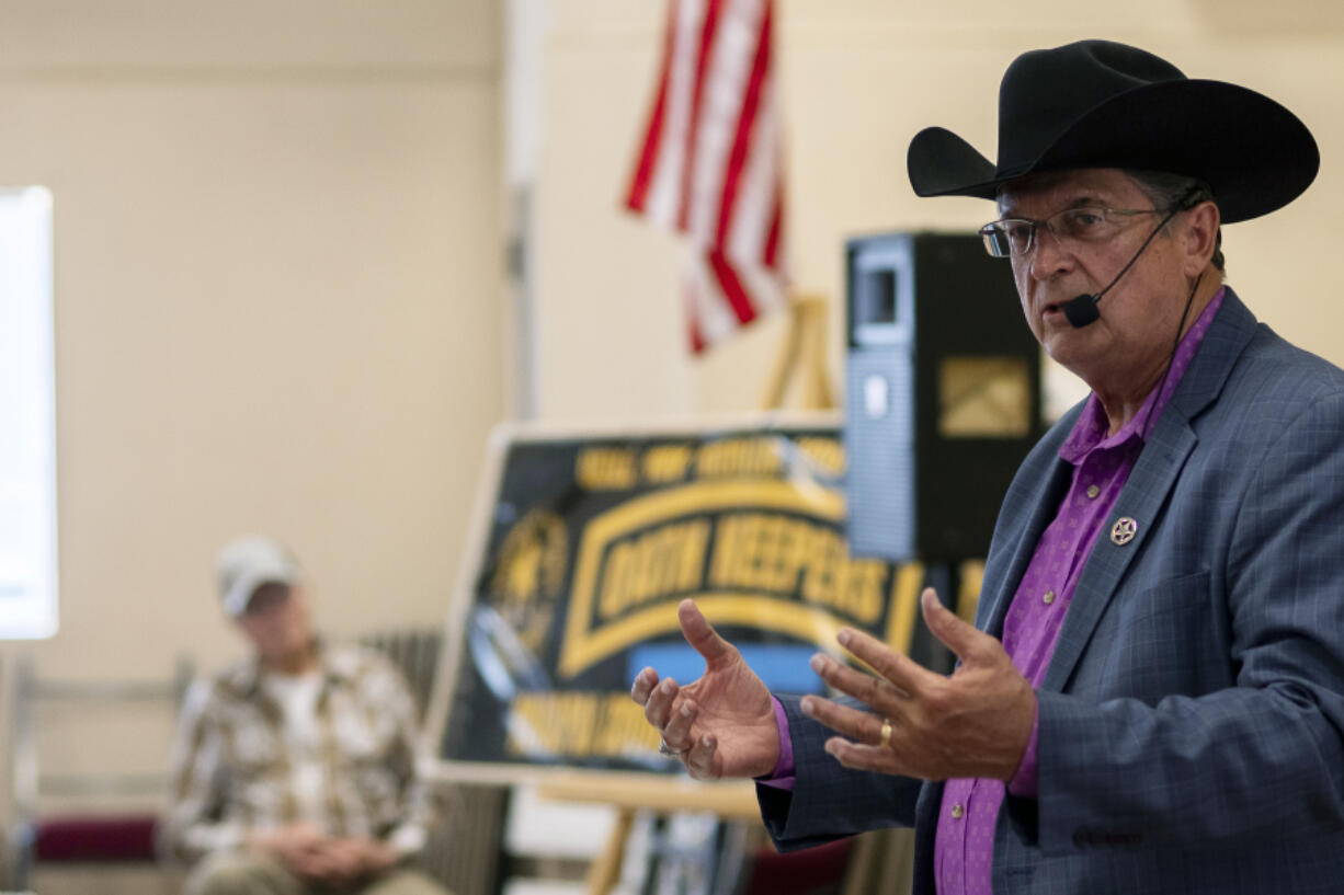 In this photo provided by the Arizona Center for Investigative Reporting, Constitutional Sheriffs and Peace Officers Association founder Richard Mack speaks to a crowd of about 100 people at a Yavapai County Preparedness Team meeting in Chino Valley, Ariz., Oct. 8, 2022. Mack regularly speaks at events and trainings for the public, law enforcement and county officials.