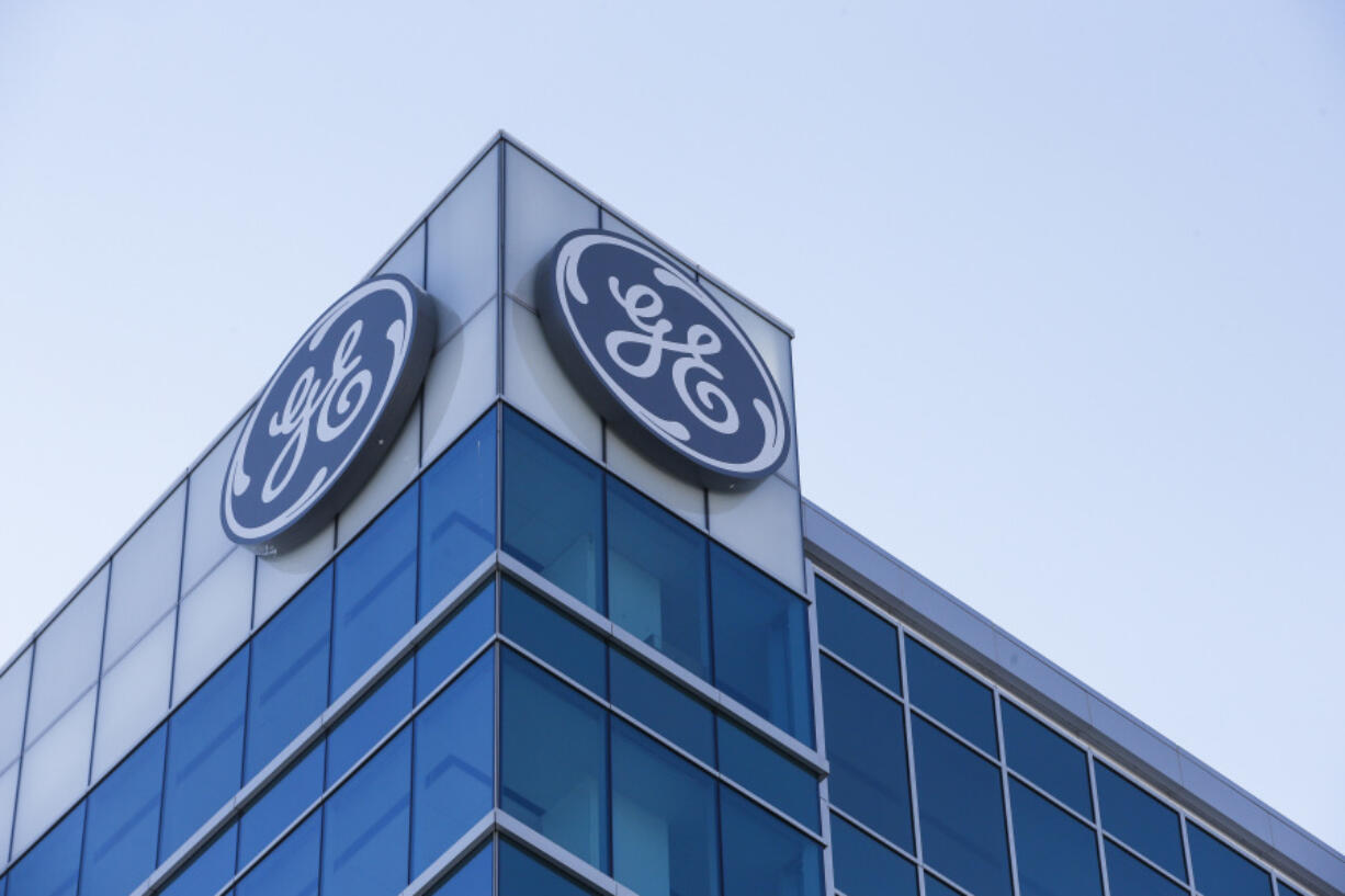 FILE - The General Electric logo is displayed at the top of their Global Operations Center, Tuesday, Jan. 16, 2018, in the Banks development of downtown Cincinnati. More than 1.5 million dehumidifiers sold under five brand names: Kenmore, GE, SoleusAir, Norpole and Seabreeze are under recall following reports of nearly two dozen fires, the U.S. Consumer Product Safety Commission said Wednesday, Aug. 16, 2023.