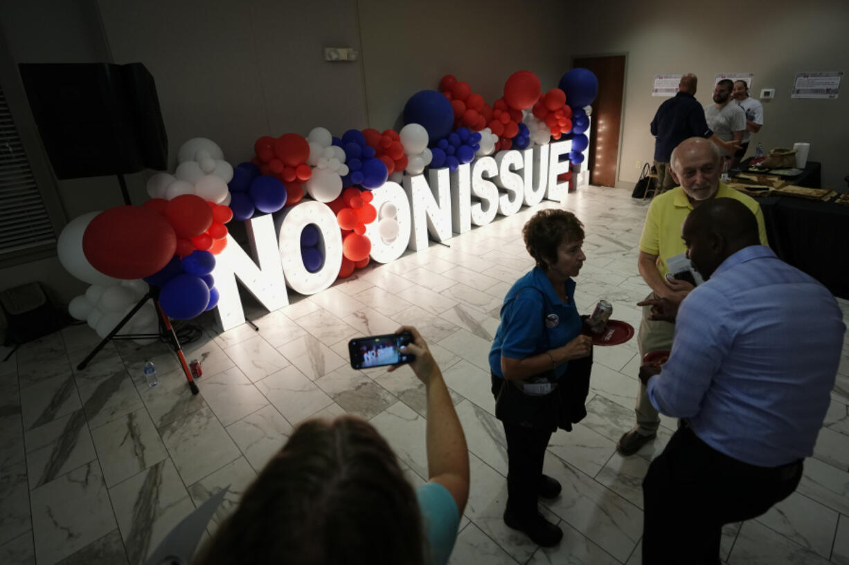 People celebrate the defeat of Issue 1 during an election night party at the Columbus Fire Fighters Local 67 on Tuesday, Aug. 8, 2023 in Columbus, Ohio. Ohio voters have rejected a proposal that would've made it more difficult for voters to amend the state constitution, including one measure set for the November ballot that would guarantee abortion rights in the state.