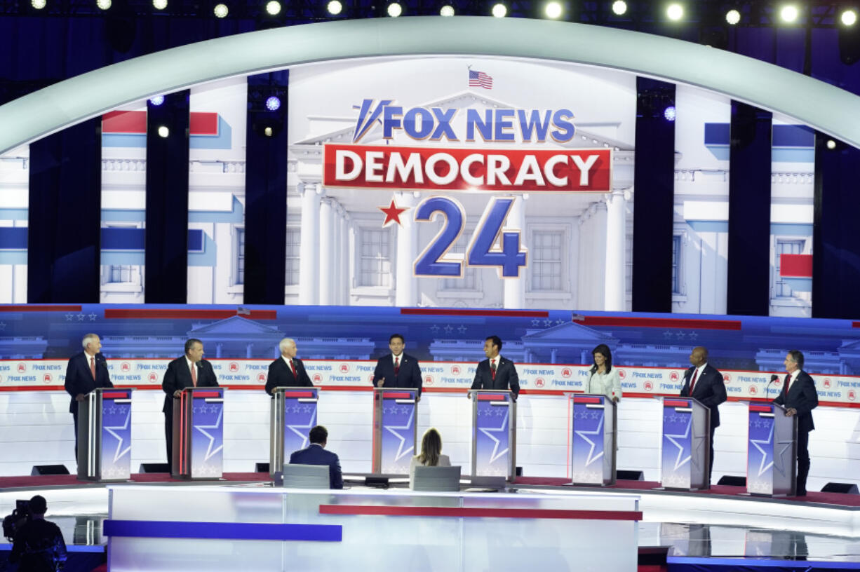 FILE - Republican presidential candidates, from left, former Arkansas Gov. Asa Hutchinson, former New Jersey Gov. Chris Christie, former Vice President Mike Pence, Florida Gov. Ron DeSantis, businessman Vivek Ramaswamy, former U.N. Ambassador Nikki Haley, Sen. Tim Scott, R-S.C., and North Dakota Gov. Doug Burgum stand at their podiums during a Republican presidential primary debate hosted by FOX News Channel Wednesday, Aug. 23, 2023, in Milwaukee.