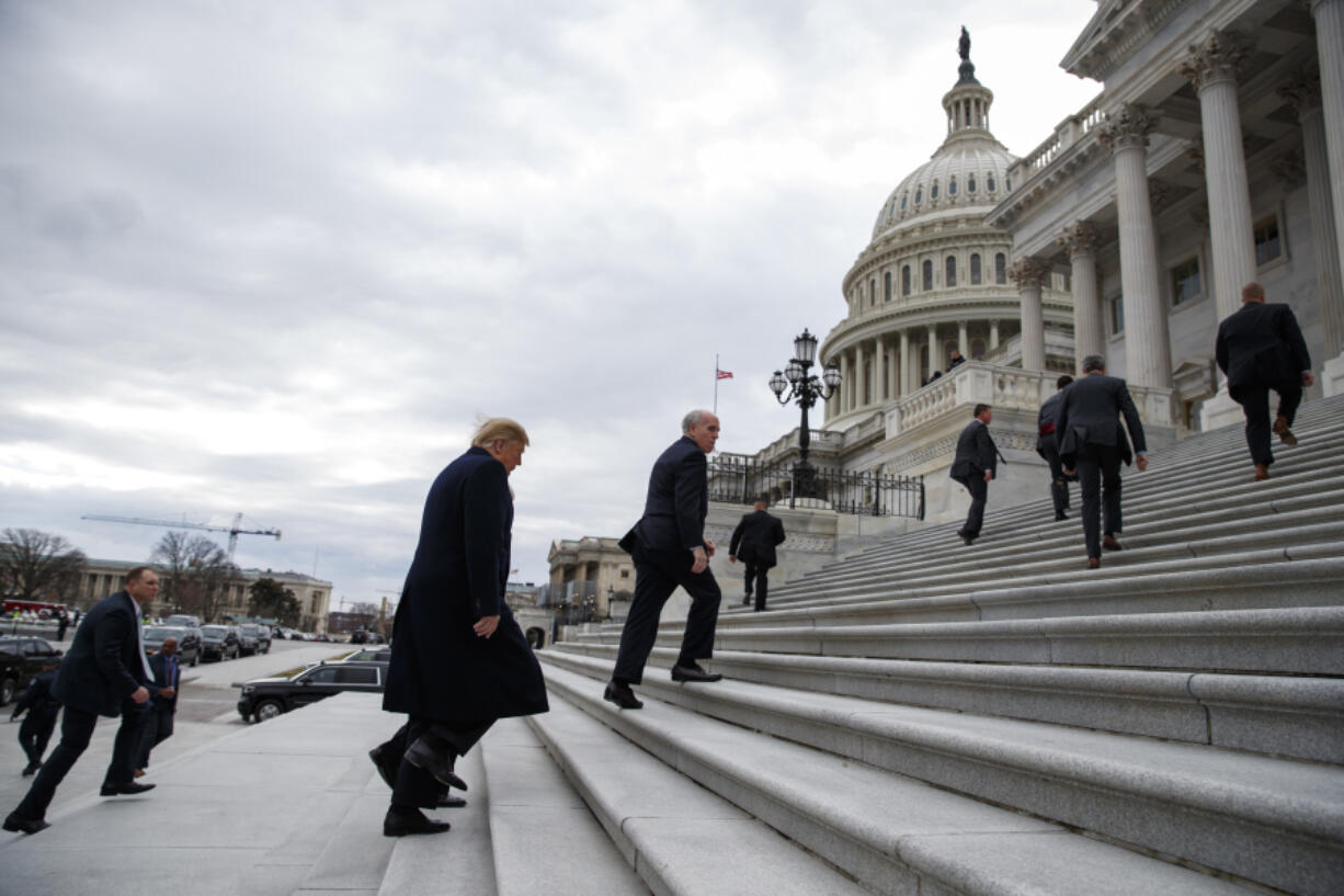 FILE - President Donald Trump arrives on Capitol Hill for a Senate Republican policy lunch, Jan. 9, 2019, in Washington.