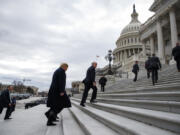 FILE - President Donald Trump arrives on Capitol Hill for a Senate Republican policy lunch, Jan. 9, 2019, in Washington.