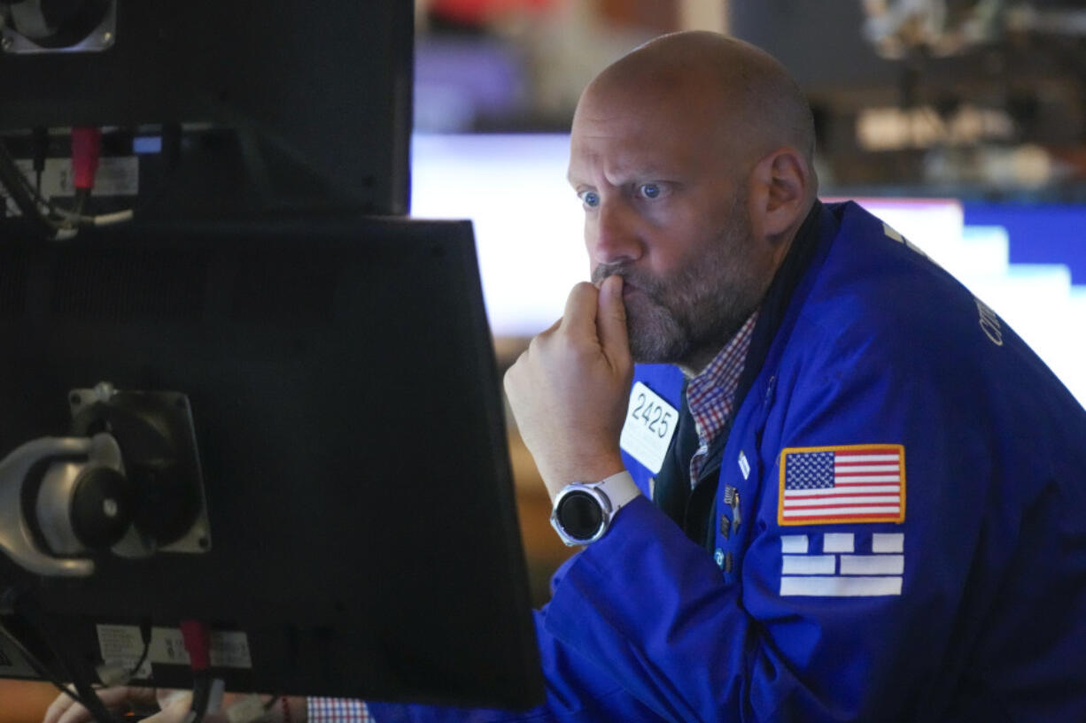 Traders work on the floor at the New York Stock Exchange in New York, Wednesday, July 26, 2023. Stocks are opening mixed as Wall Street waits to hear what the Federal Reserve will do with interest rates later in the afternoon.