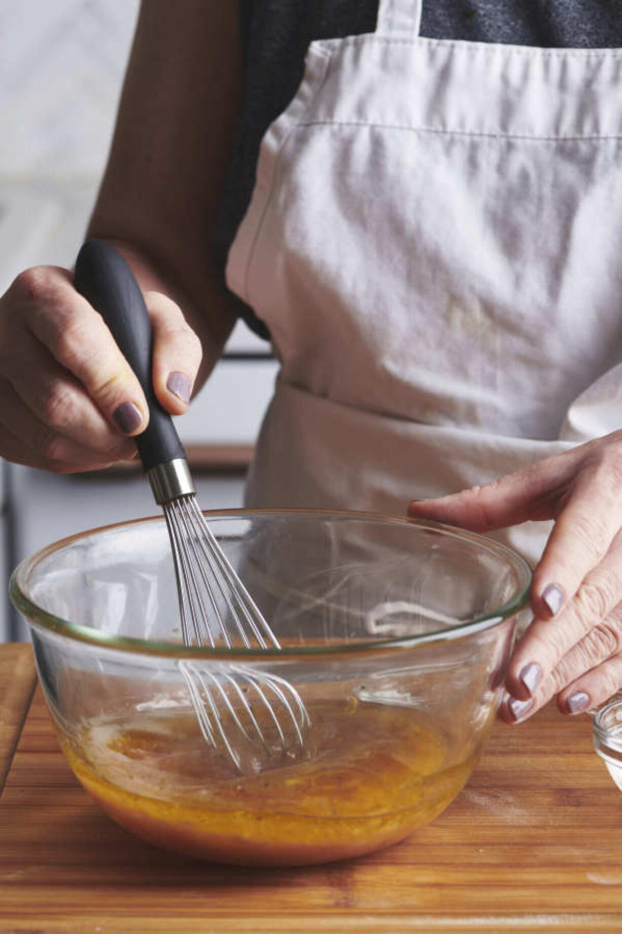 This August 2019 image shows a recipe for vinaigrette. If you take a couple of minutes to play with some different oils and vinegars, you'll quickly see how easy it is to make a homemade vinaigrette, and to keep changing it up so your salads sparkle all year long. (Cheyenne M. Cohen via AP) (Cheyenne M.