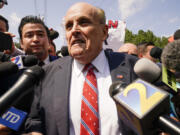 Rudy Giuliani speaks outside the Fulton County jail, Wednesday, Aug. 23, 2023, in Atlanta. Giuliani has surrendered to authorities in Georgia to face an indictment alleging he acted as former President Donald Trump's chief co-conspirator in a plot to subvert the 2020 election.