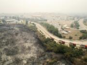 Burnt trees are seen from above near the hospital in the town of Alexandroupolis, in the northeastern Evros region, Greece, Tuesday, Aug. 22, 2023. Hundreds of firefighters struggled Tuesday to control major wildfires burning out of control for days in northeastern Greece and on Tenerife in Spain's Canary Islands, with strong winds fanning the flames and prompting evacuations of villages and a city hospital in Greece.